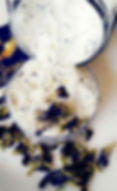 White salt and blue flowers spilling, Amae Psoriasis Relief Bundle for skincare needs.