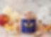 Perfect Peach Body Soak, candles, peach slices, and Amae Psoriasis Relief Bundle on white towels.