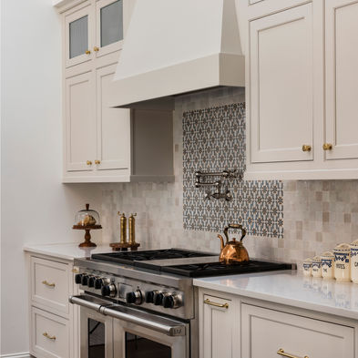 Brenshaw Custom Home Renovation - kitchen renovation with new range, hood, and cabinets