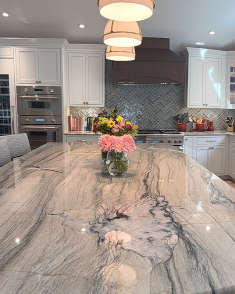 This beautiful new kitchen's island features Poseidon Polished Quartzite