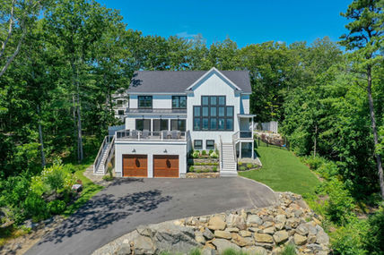 Exterior and grounds of a charming coastal Ogunquit home design-build by Coastal General Construction, Inc.