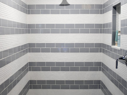 Shower redesign: Shower walls & Shower Floor feature Anatolia Soho cloud blue matte 3x6 and Anatolia Soho Penny canvas white matte. Bathroom design by Ogunquit Home Design Showroom.
