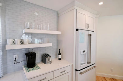 Custom coffee bar with floating shelves is part of sweeping condominium renovations by Coastal General Construction in Ogunquit, Maine.