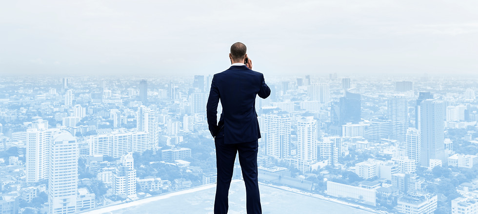 rear-view-businessman-talking-phone-top-building.jpg