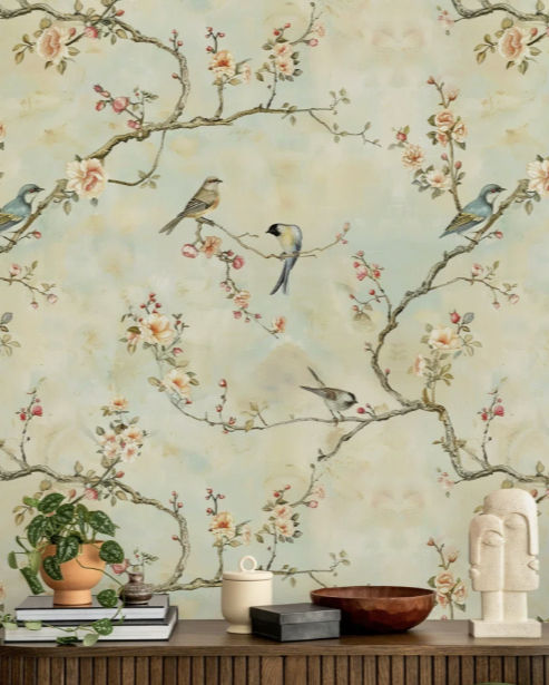 Floral wallpaper with birds on branches. Soft pastel colors create a serene mood.
