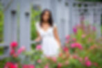 DeSales senior pictures in Westerville wearing white dress with pink roses