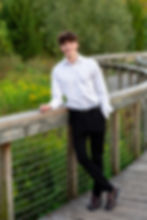 what to wear in summer senior picture in Westerville showing suit without jacket