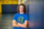 Olentangy high school senior picture of wrestling senior photo against mat in wrestling room