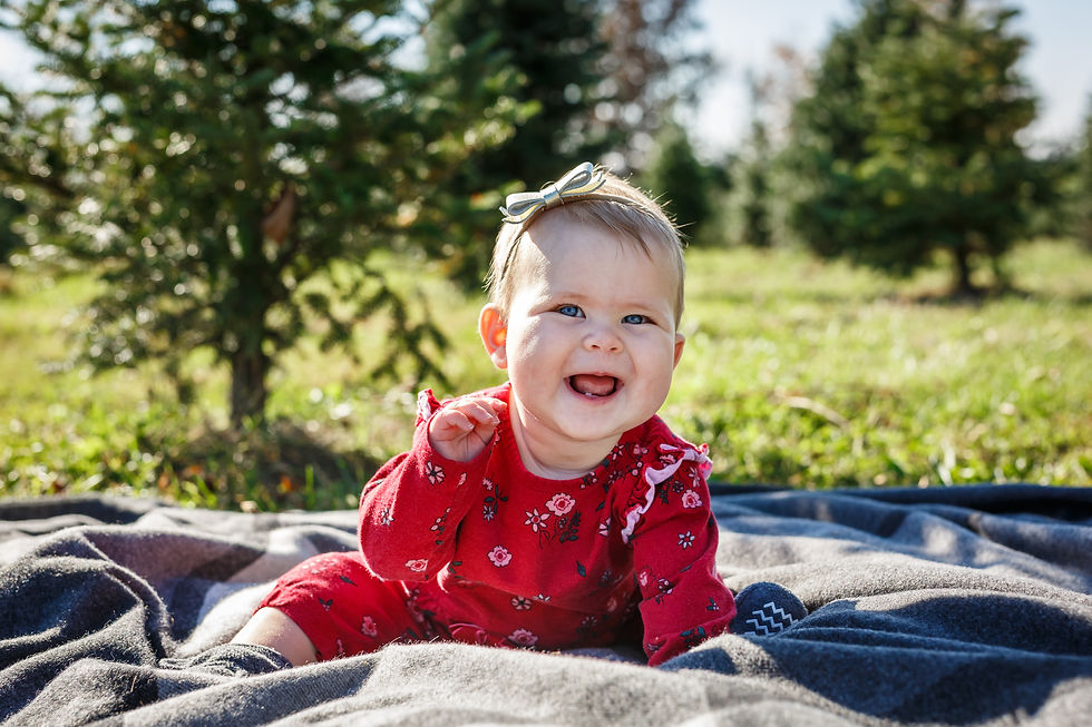 Mini photoshoot of baby outside at tree farm in Delaware Ohio
