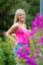 pink top for summer senior pictures in flower field near Westerville, Ohio