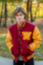 Westerville North senior in varsity jacket in park in Fall in Ohio