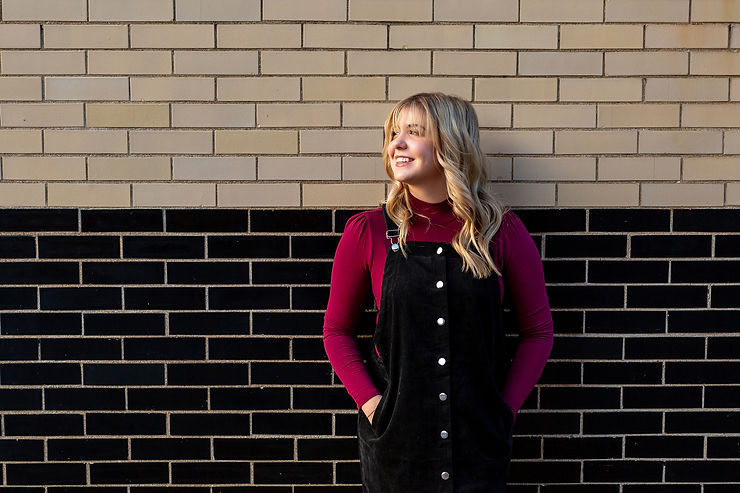 uptown westerville senior picture with 2-tone wall