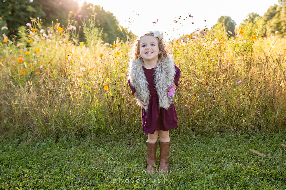 sunset family picture golden hour of girl in flower field