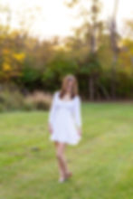 Olentangy senior picture in field in white dress