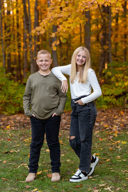 Sibling picture of sister and brother for Fall mini session in Westerville with trees in the background.