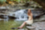 Waterfall senior picture in Columbus Ohio of Olentangy Senior in dress and barefoot