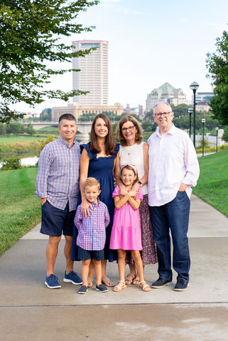 Posed extended family picture in downtown Columbus with downtown skyline in background