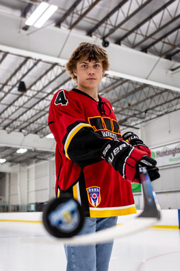 Columbus senior picture of Westerville Warcat hockey player wearing jersey at ice rink