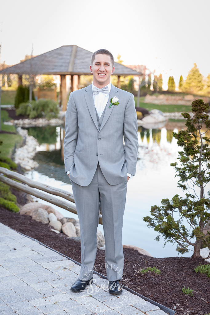 prom photo location near Westerville and Lewis Center guy in suit shows off pond location
