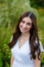 closeup senior portrait of Reynoldsburg High School senior in white dress in summer senior pictures in field
