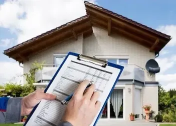 Property inspector completing checklist for house