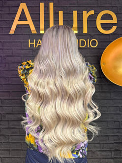 Platinum blonde long layers by Canary Wharf hairdressers. Best top rated hair salon