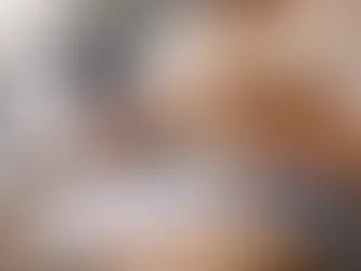 person working on laptop at home reviewing mortgage options with cockapoo on lap