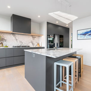 Built By Dre 
Castor Bay renovation Kitchen design by Guyco Kitchens, stone by CDK, fabricator Ora Stone