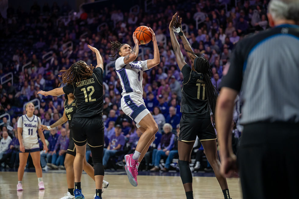 Zyanna Walker shooters over a defender in Bramlage Coliseum.