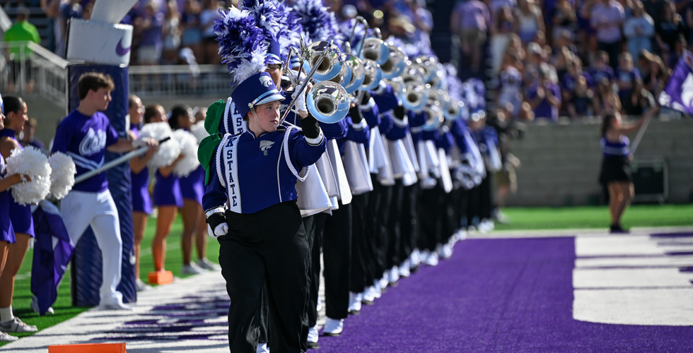 The american flag and kansas flag being held up during the pre-game. Courtesy: Cam Hutchinson