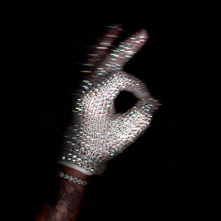 The album cover of Iceman features a bejeweled glove that sparkles against a dark background.