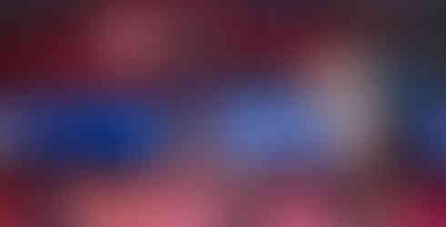 A K-State volleyball player spikes the ball.