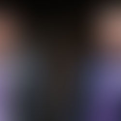 Christian Peña and Caden Bastian sit on stage next to each other.