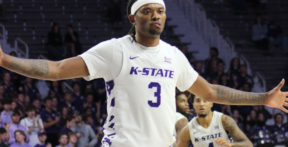 A K-State player holds out his arms against a Tulsa player. Courtesy: Dekan Vanderbilt.