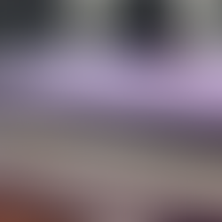 A stack of Royal Purple Yearbooks.