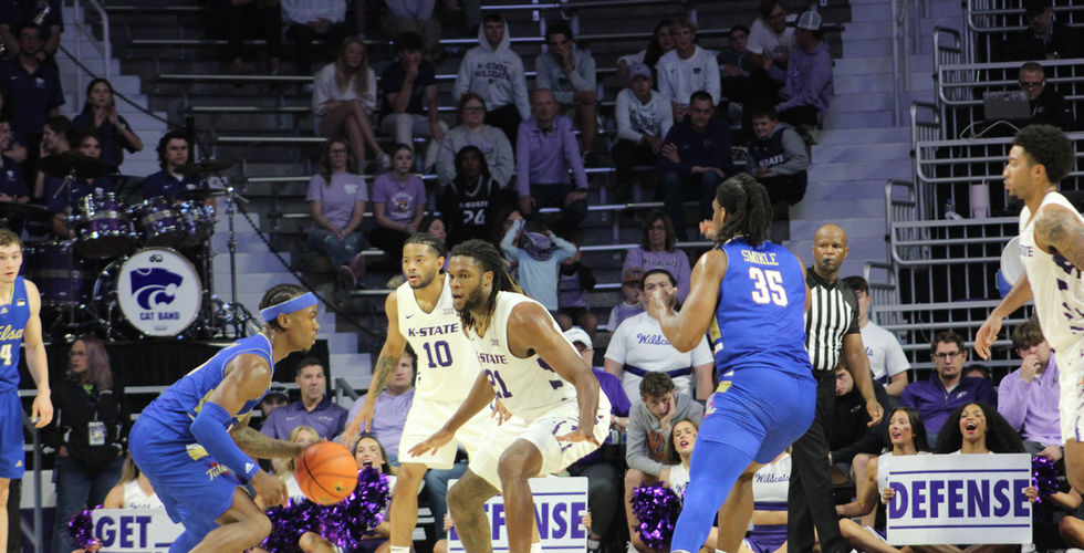 K-State defends against a Tulsa player on offense.