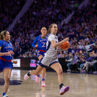 Serena Sundell dribbles down the court and prepares to score a layup.