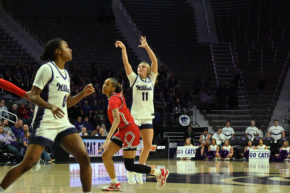 Taryn Sides shoots a three pointer over a Lamar Cardinal defender.
