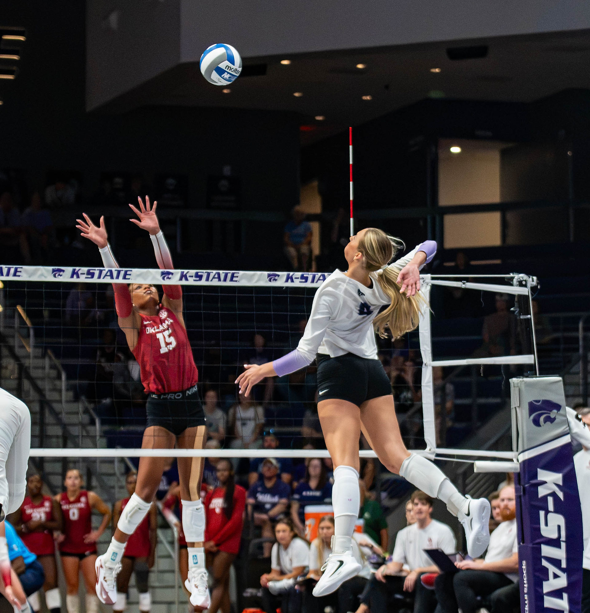 Reagan Fox spikes the ball against Oklahoma’s Alaleh Tolliver during Kansas State volleyball’s match.