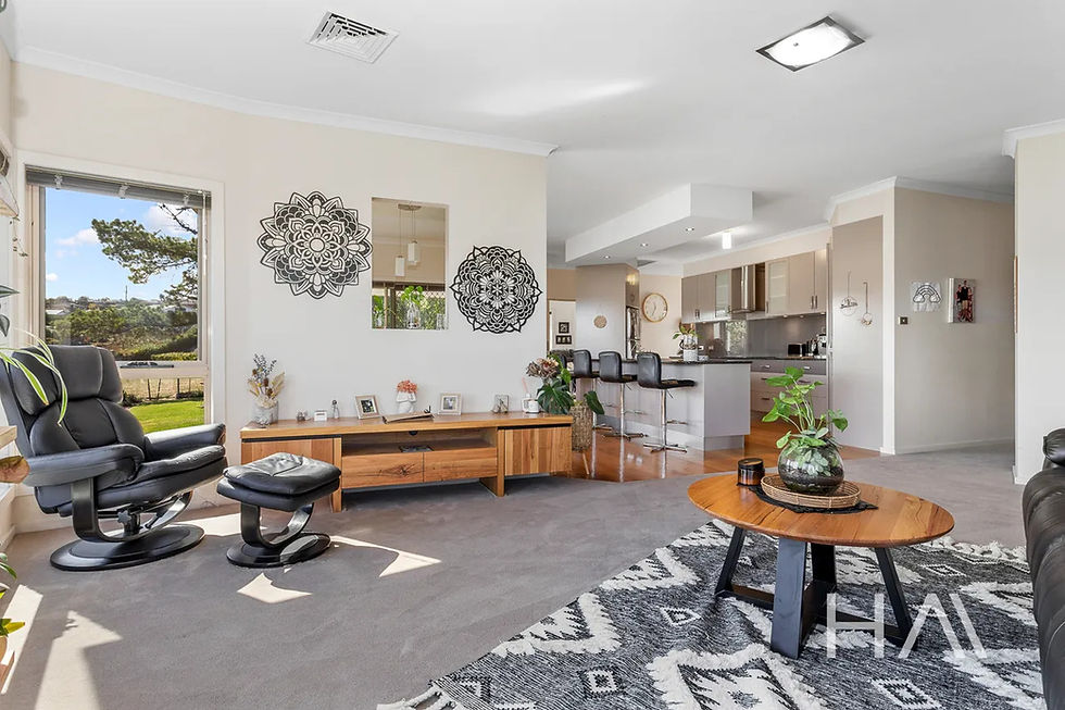 Immaculate, contemporary living room with elegant decor and a fresh ambiance, meticulously maintained by Tidy Delights.