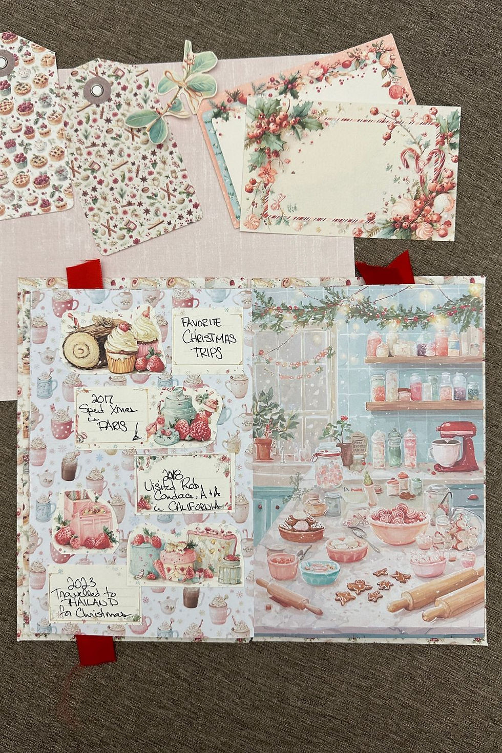 Junk journal open to a page with a Christmas baking theme and handwritten tags.