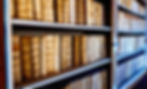 Library shelf with old books