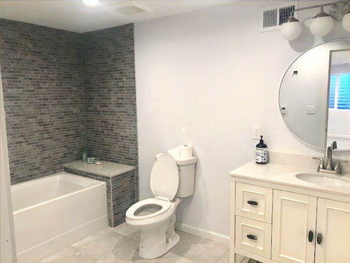In floor heat, alcove tub installation, tile tub surround, tile floor, in floor hear, in tile floor heat, custom vanity fabrication, custom quartz vanity top installation, custom vanity installation. 