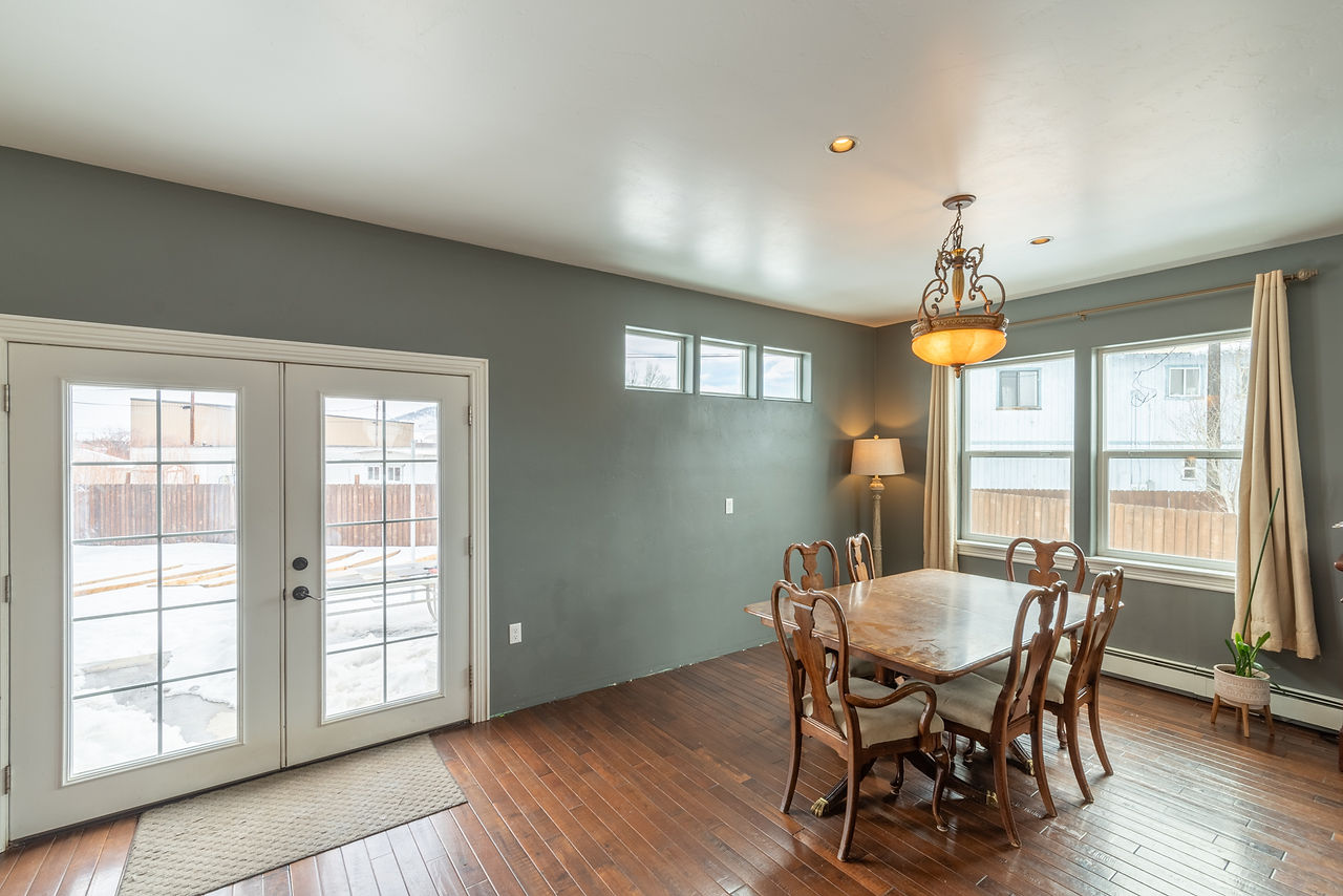 Dining room with wood floors.