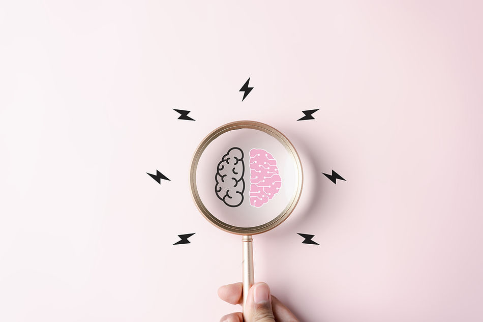 Pink brain and magnifying glass.jpg