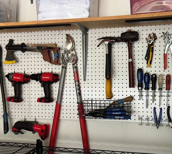 Organized pegboard with tools hanging neatly for easy access in Frisco Texas