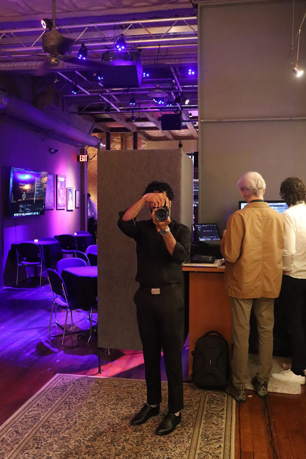 Amit taking a picture during the Nexus Night event