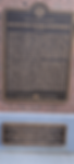 Historical marker detailing the burial site of a 19th-century sailor from the shipwreck of the Belle, with inscriptions about the sailor's life and the ship's journey.