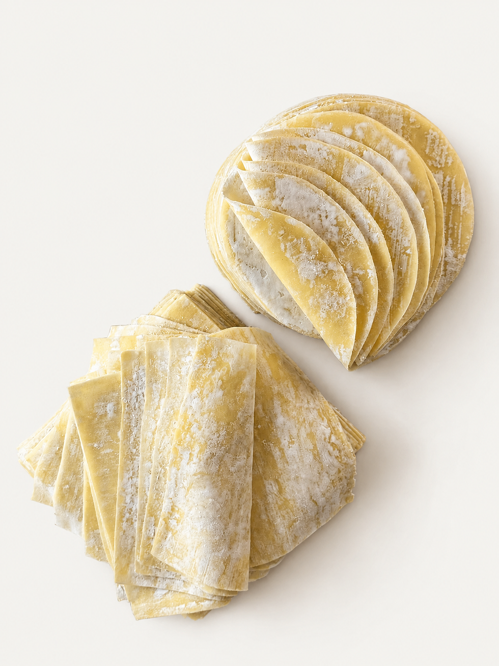Thumbnail: Fresh dumpling skins folded and arranged on a neutral background