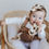 Thumbnail: Baby chewing on a teether